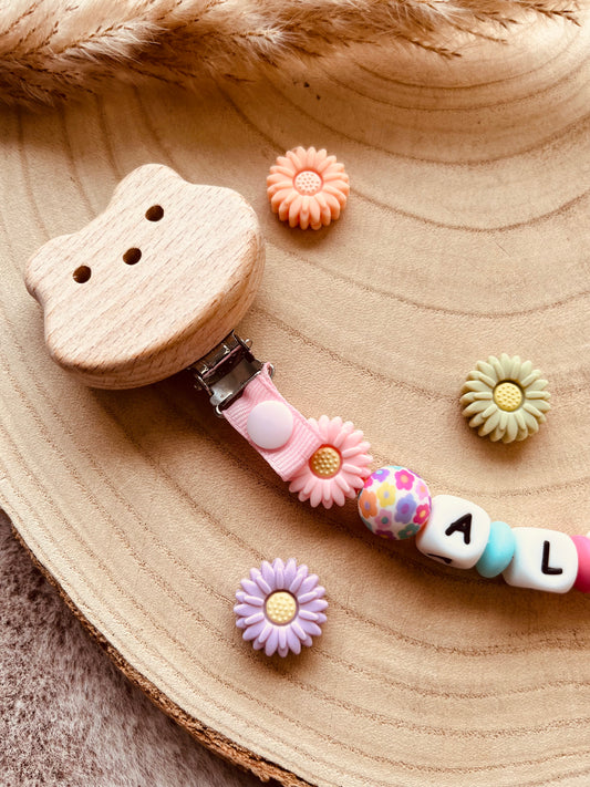 Attache tétine marguerite multicolore