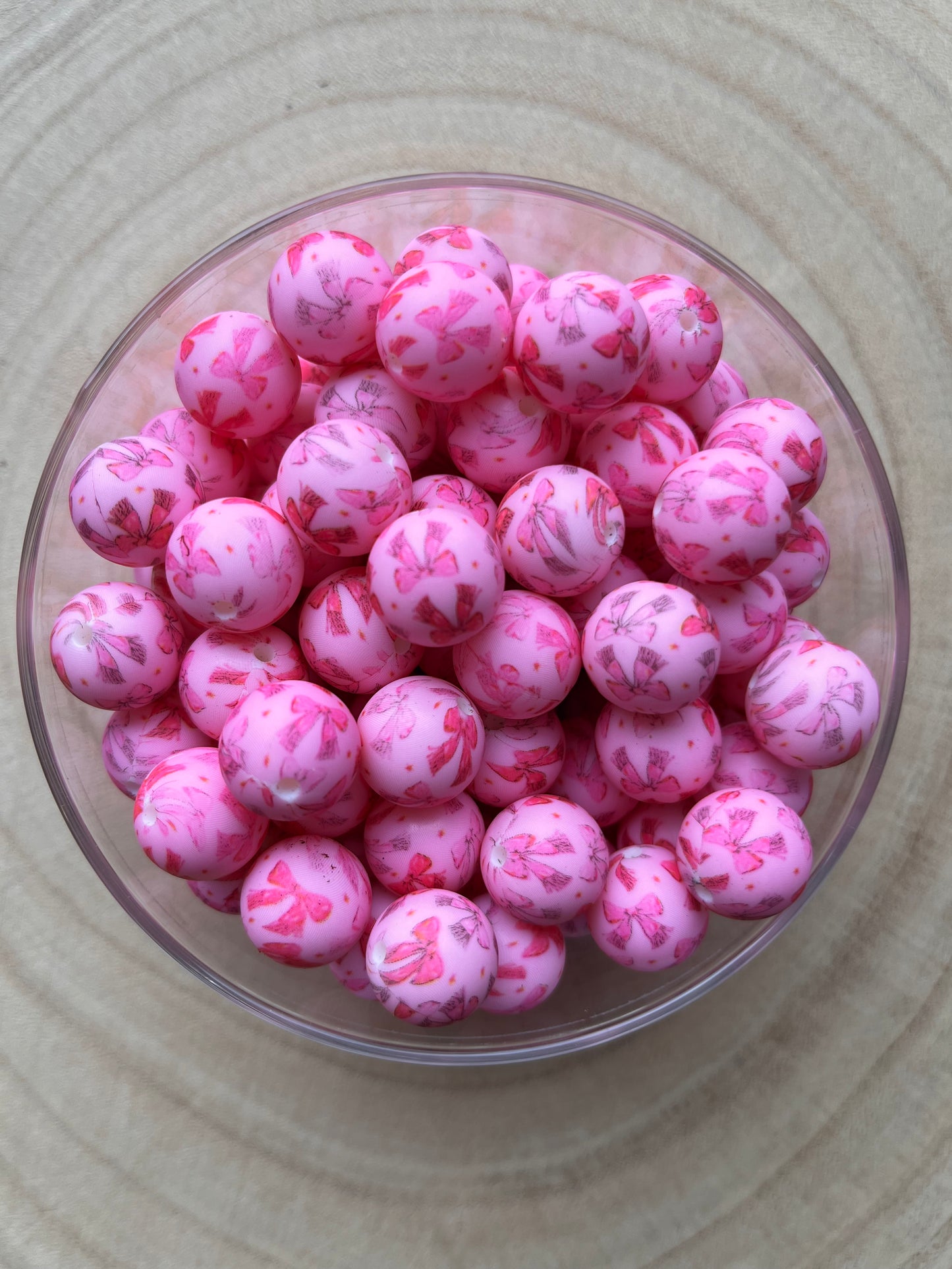 Perles en silicone imprimées nœuds roses