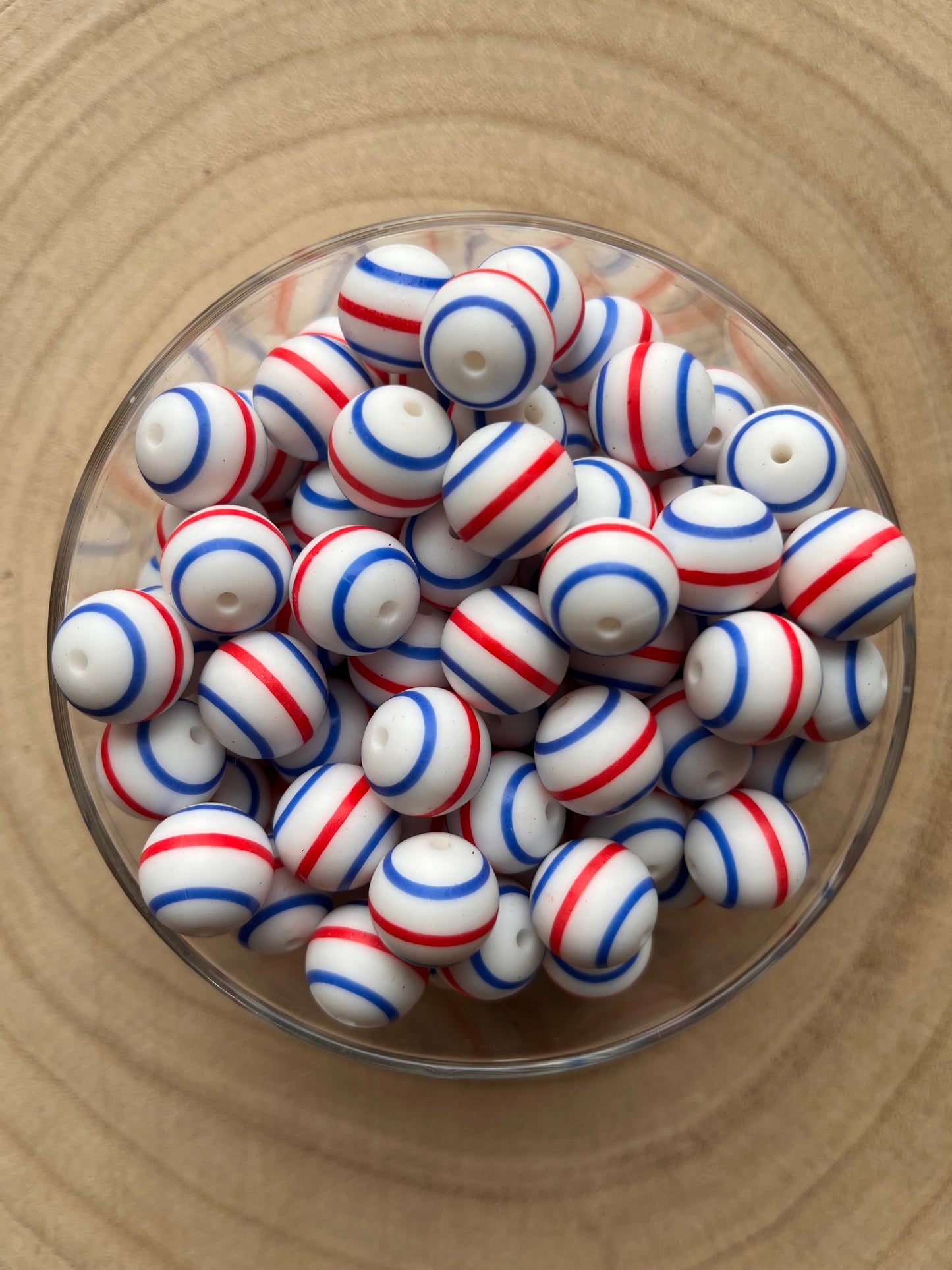 Perle silicone imprimée rayée bleue et rouge