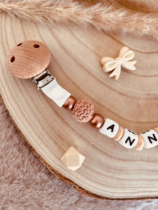 Attache tétine noeud beige