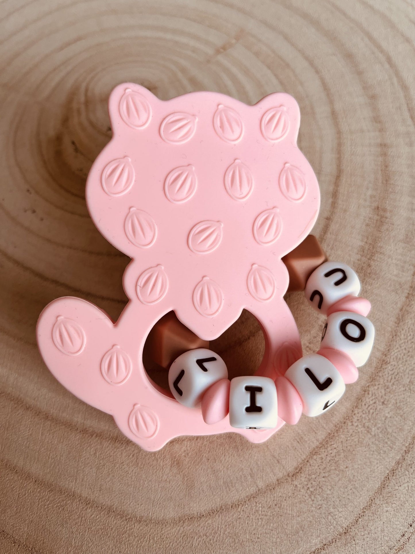 Anneau de dentition raton laveur rose vue arrière