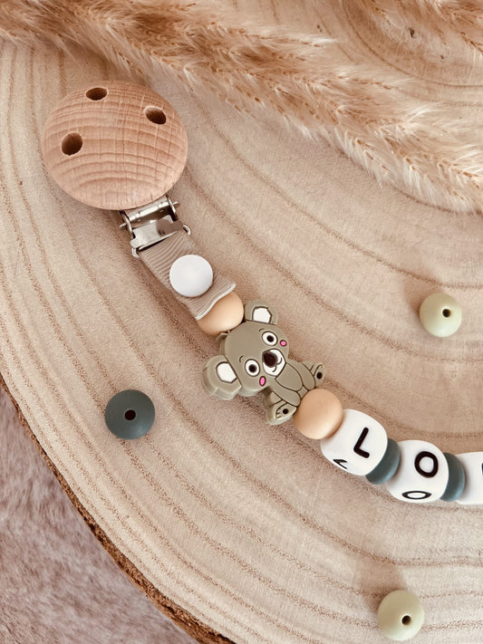 Grüne personalisierte Schnullerbefestigung