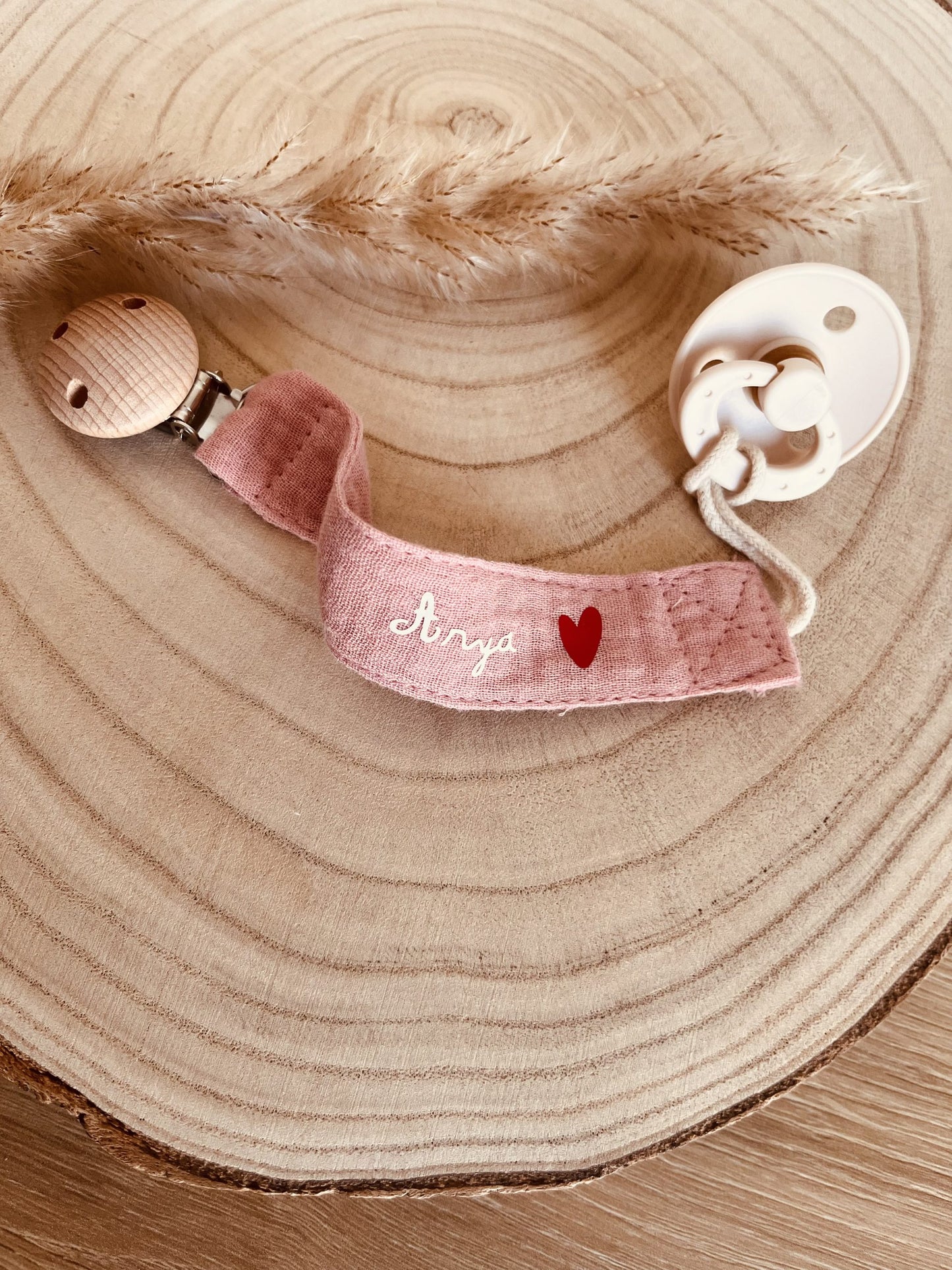 Pink cotton gauze pacifier attachment
