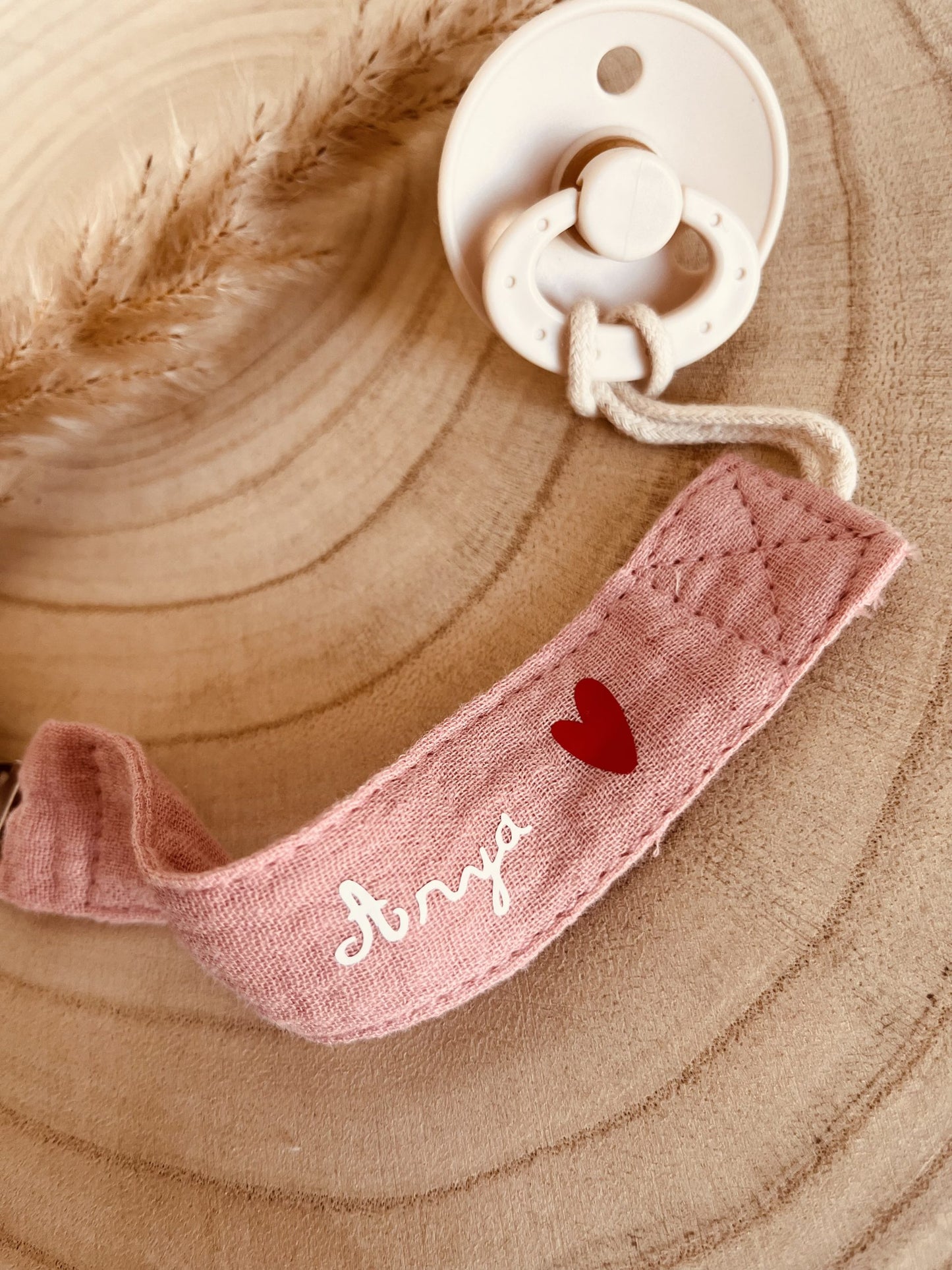 Pink cotton gauze pacifier attachment