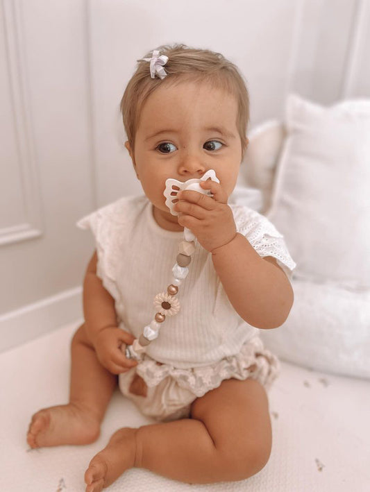 Attache tétine marguerite