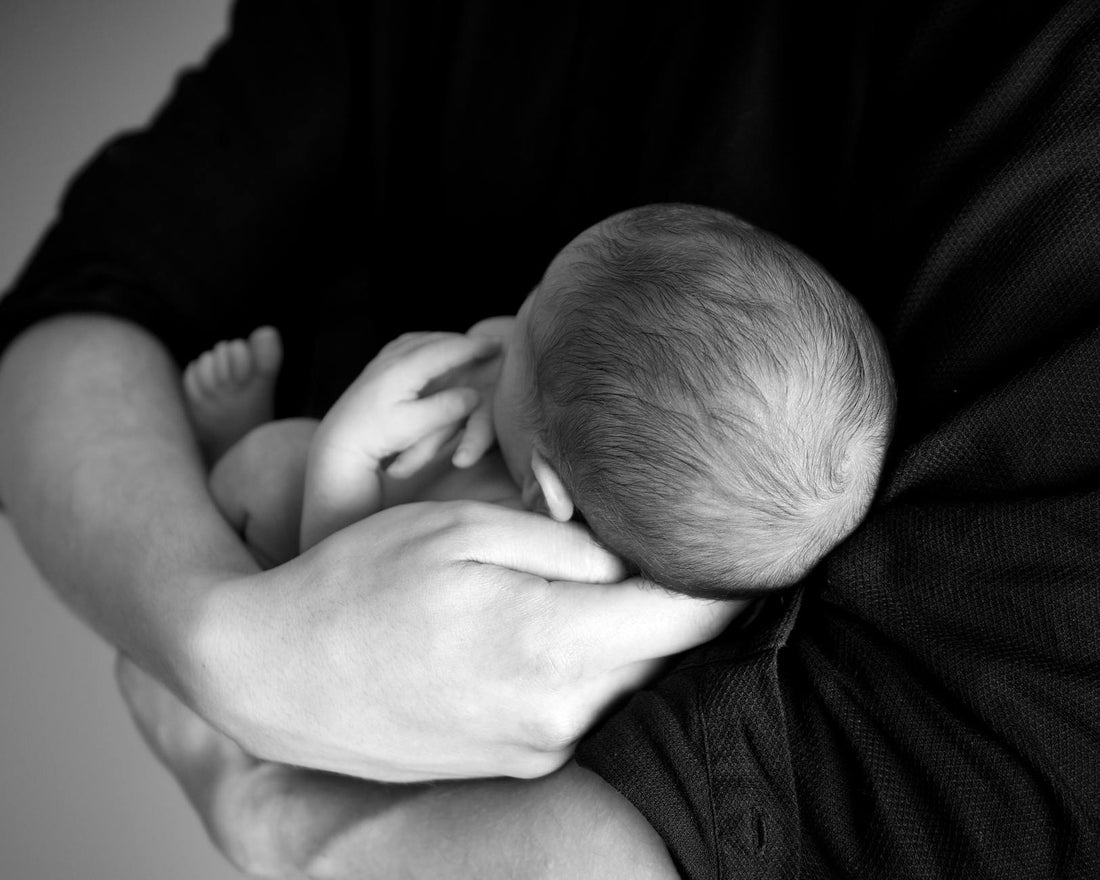 person carrying baby