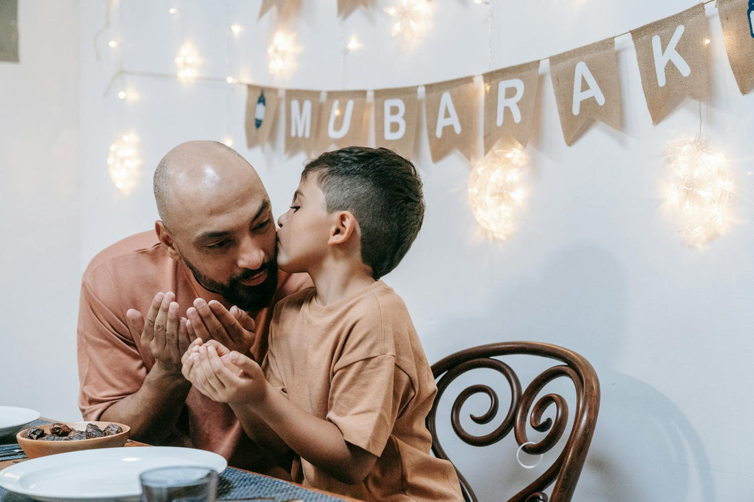father and son sitting at the table|bearded man drinking coffee sitting near daughter and wife|mother and father walking with son|mother and father walking with son