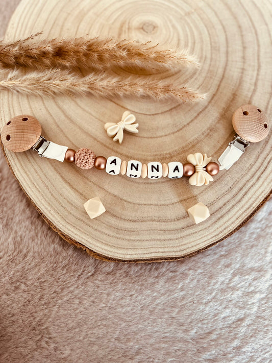 Attache doudou noeud beige