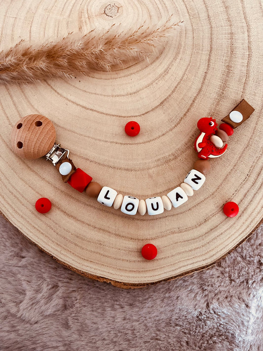 Attache-tétine personnalisée dinosaure rouge