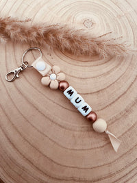 Porte clé personnalisé marguerite beige