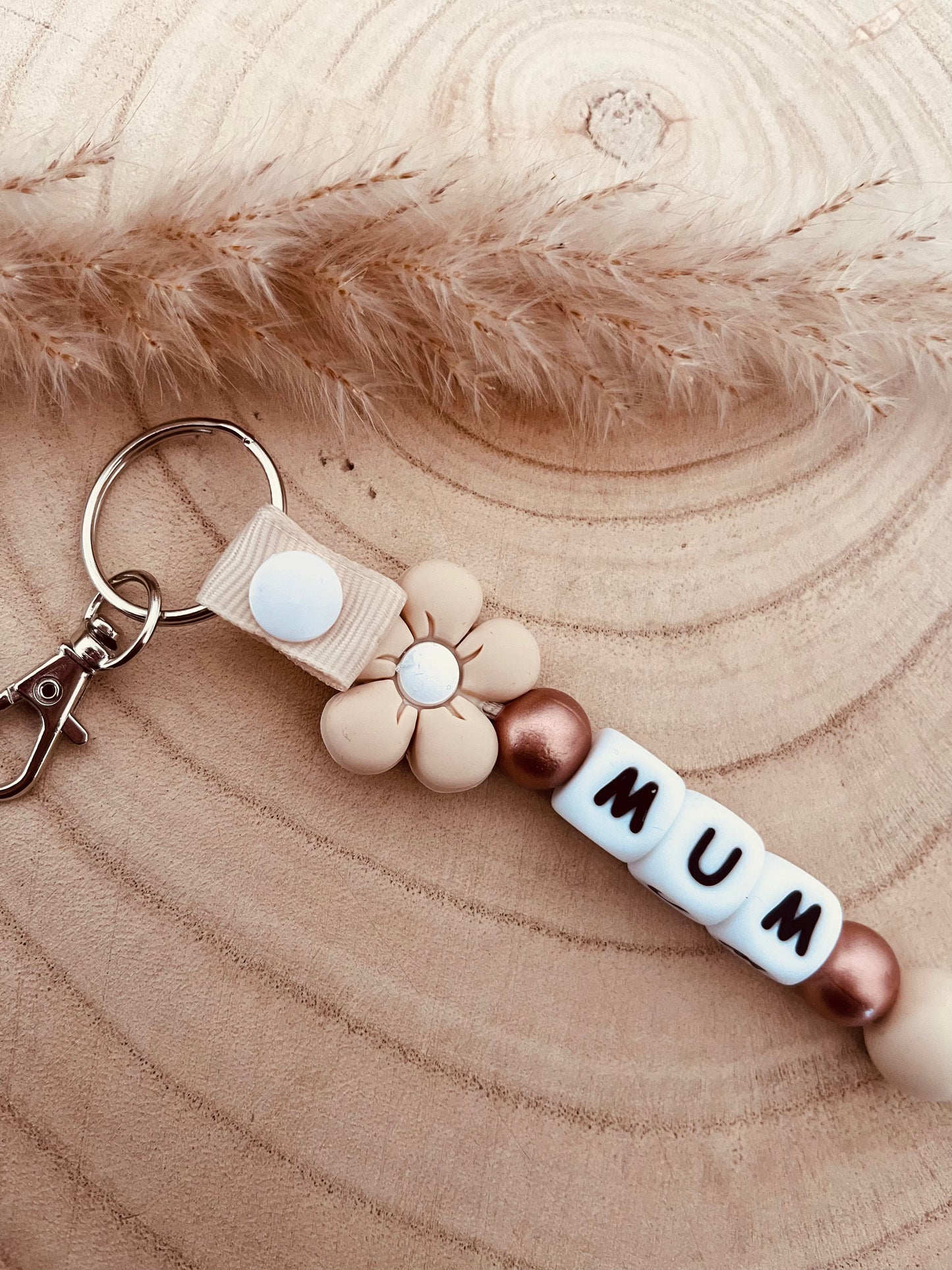 Porte clé personnalisé marguerite beige