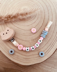 Pink chat pacifier attachment
