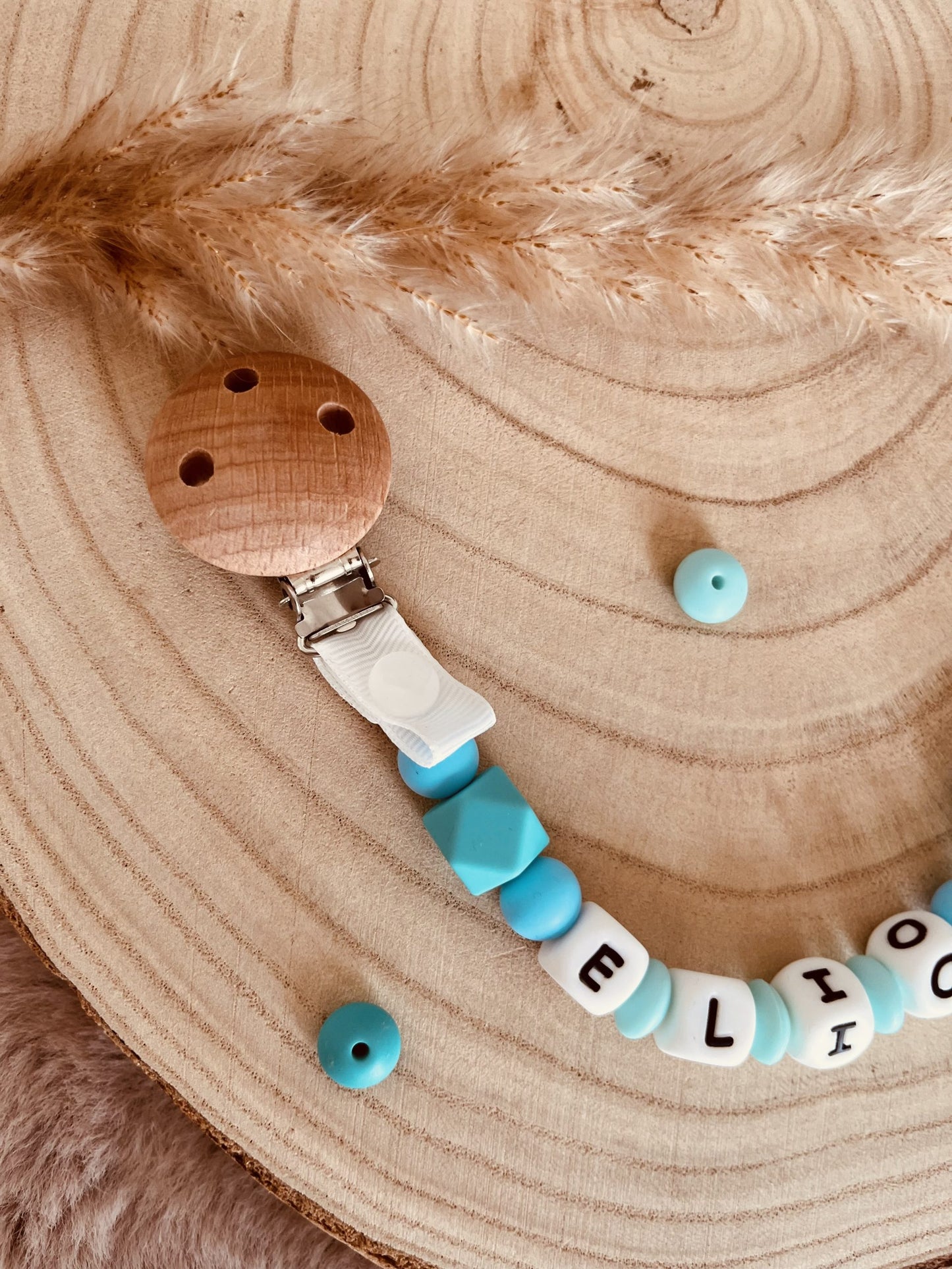 Turquoise turtle pacifier attach