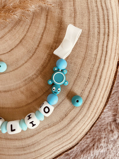 Turquoise turtle pacifier attach