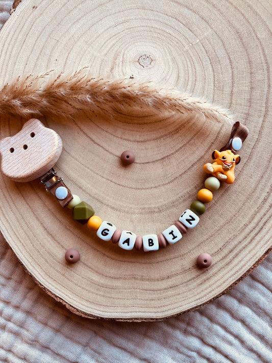 Chupetero león personalizado con cuentas de silicona alimentaria y madera de haya natural