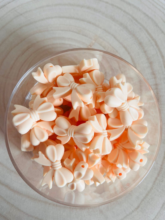 Perle silicone noeud beige