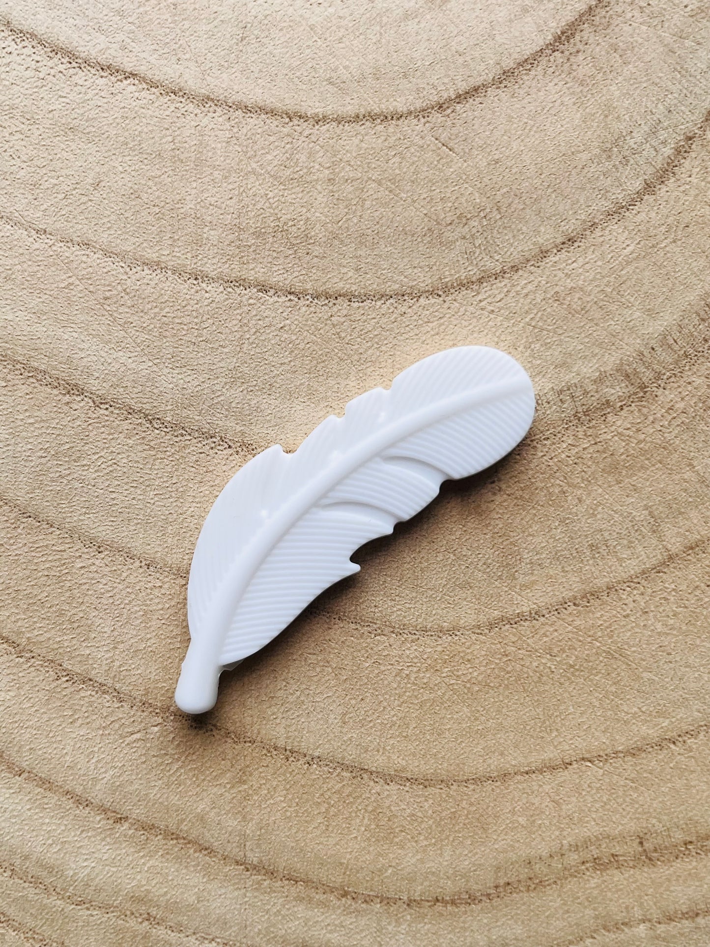 Perle en silicone Plume Blanche