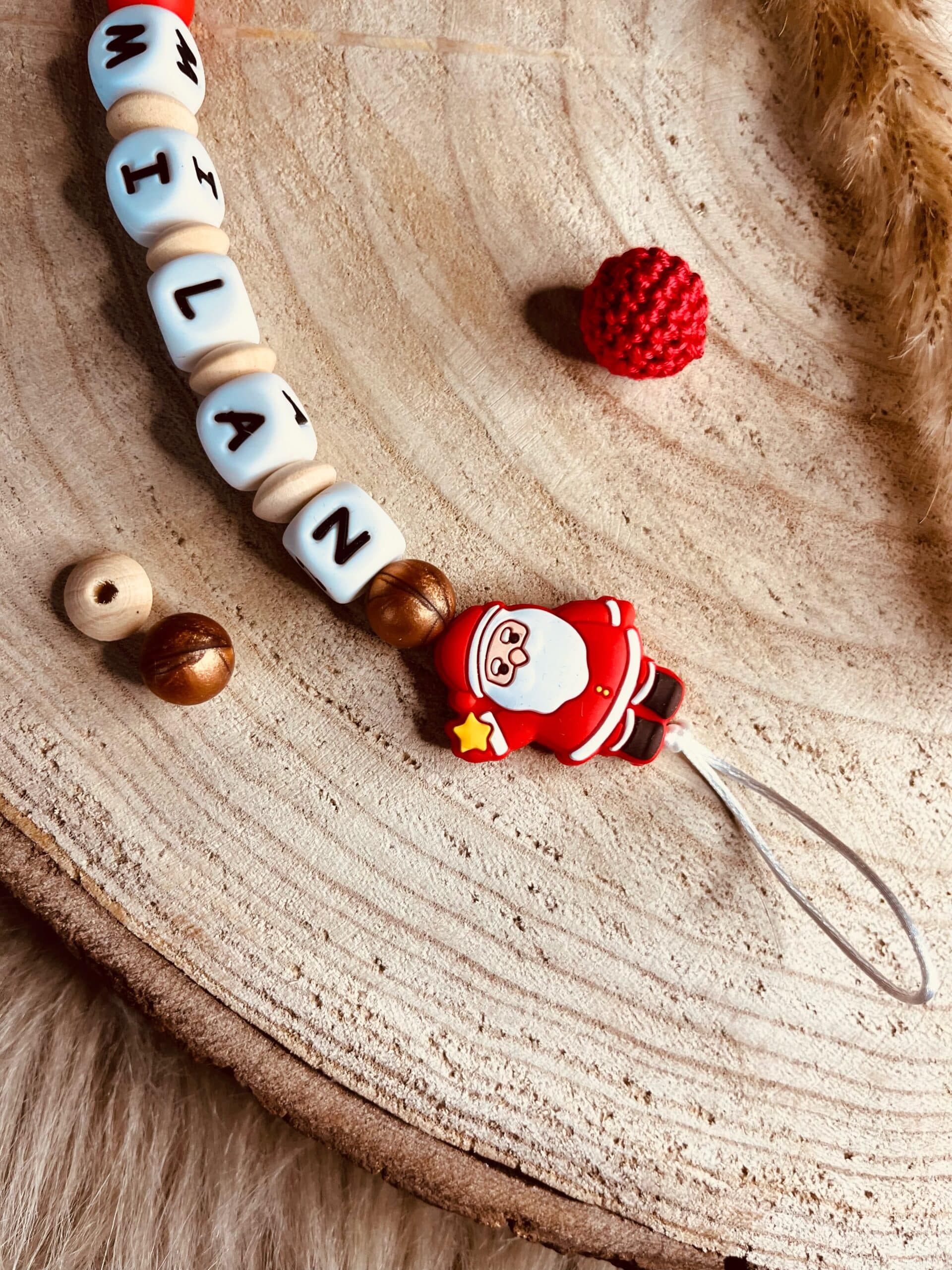 attache tétine père noel